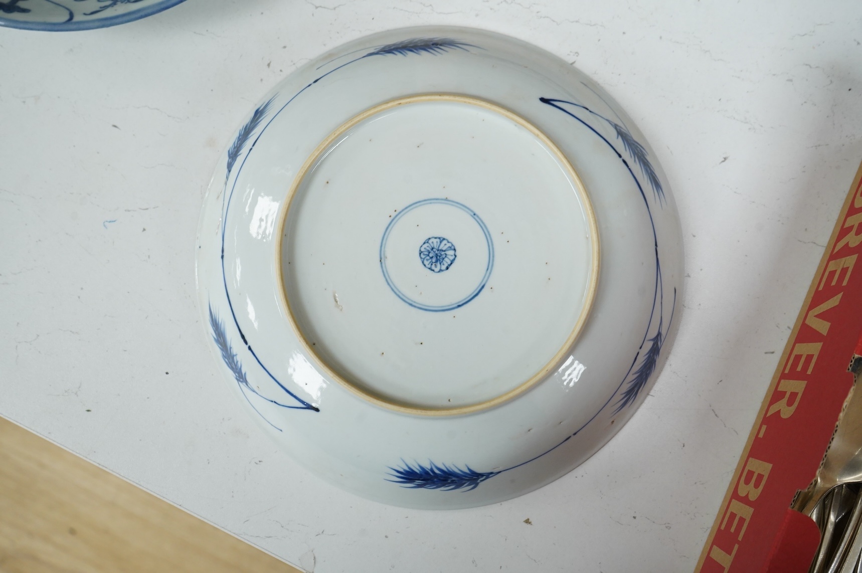Three Chinese blue and white plates, largest 26cm